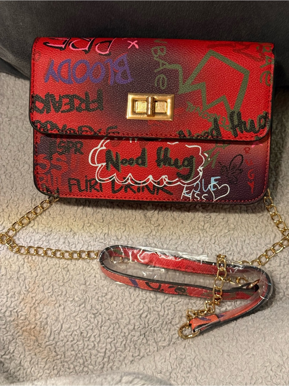 Red Graffiti Print Crossbody Bag with Gold Chain Strap